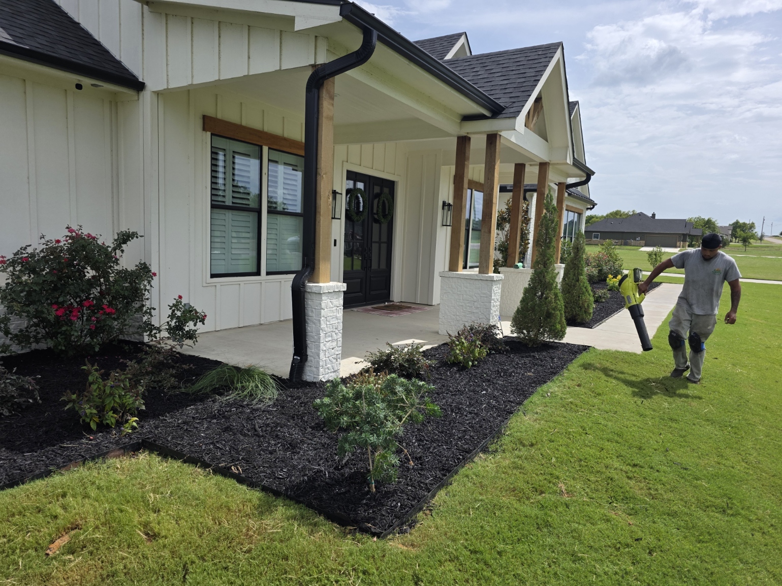 Mowed lawn with fresh flower beds