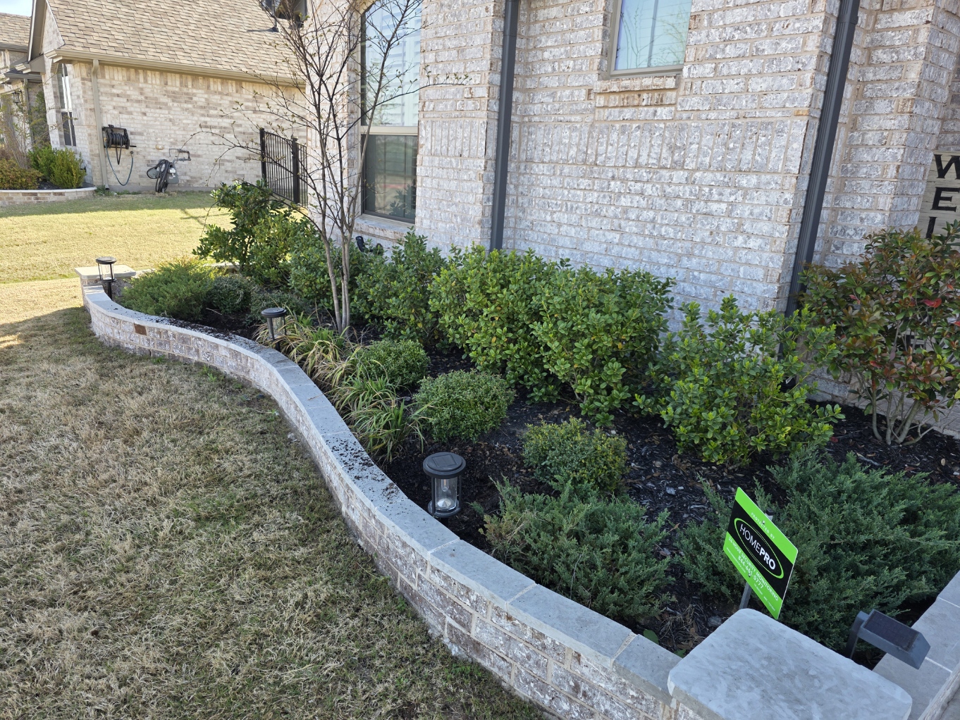 Landscaped flower bed with stone border